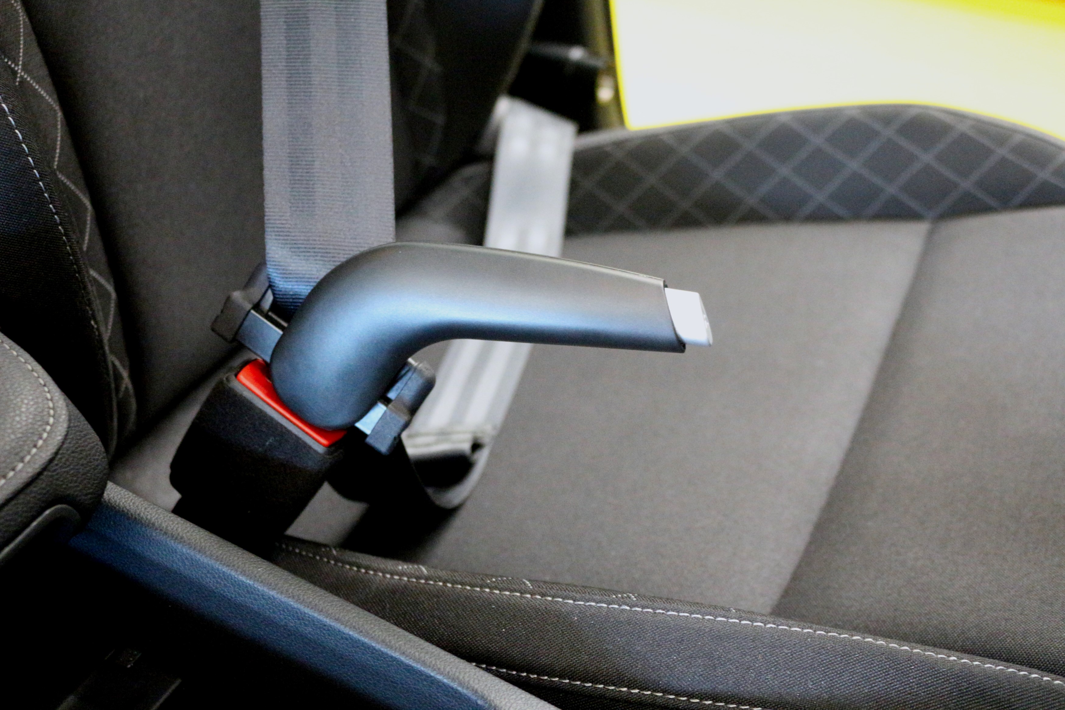 The JIMMY by Veigel is a seat buckle assist device designed to aid drivers with buckling and unbuckling the seat belt buckle in an automobile.